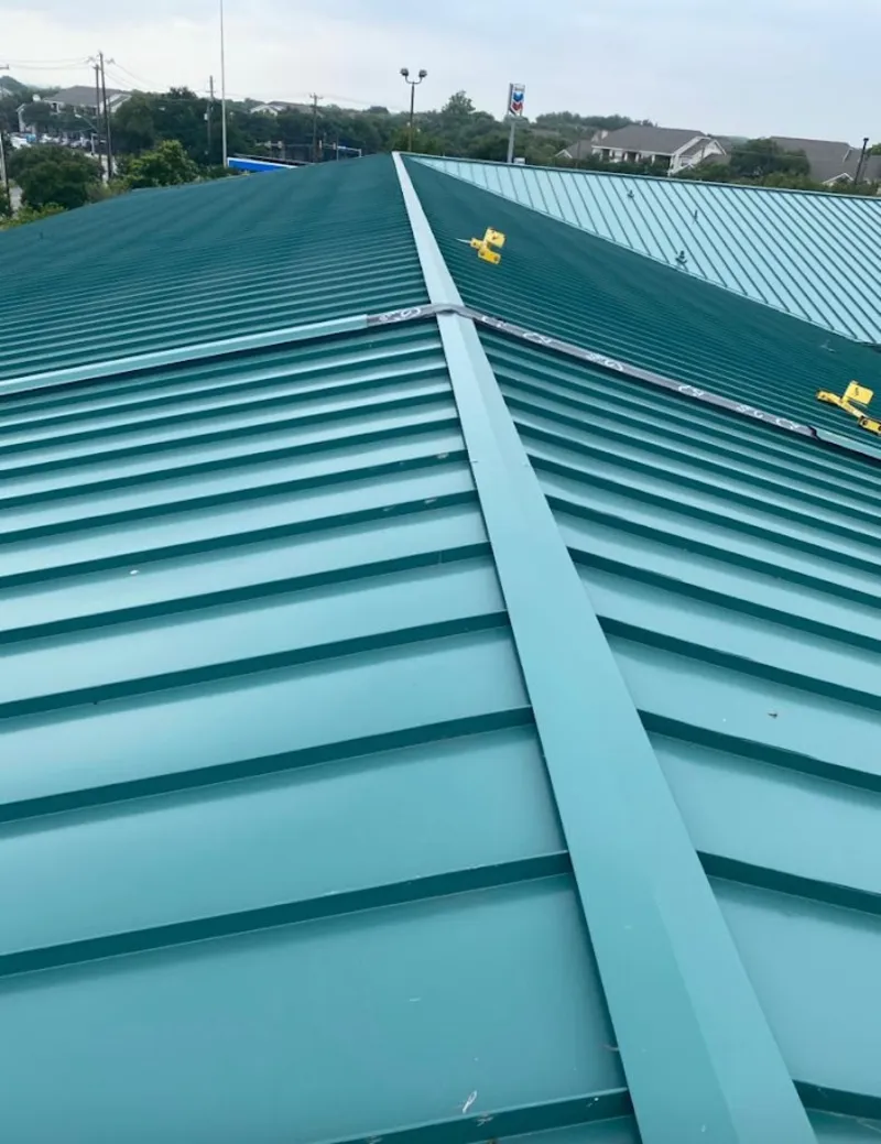 Green commercial metal roof ridge and valley for Metal Roof Repair in West Frankfort