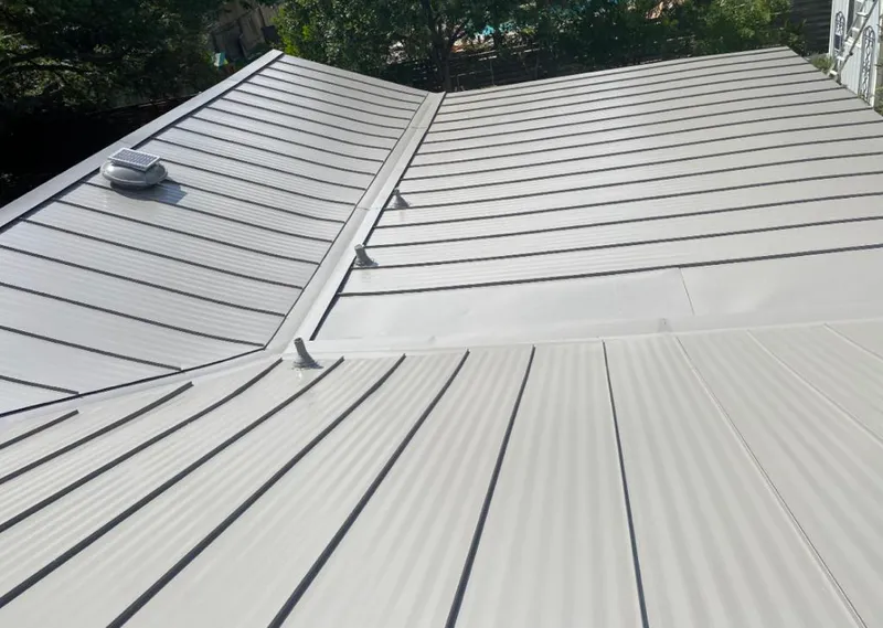 Solar attic fan installed on a metal roof for Roof Ventilation in West Frankfort